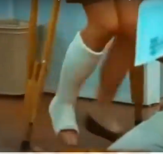 fidgeting with the long cast on my leg, my fingers gripping the edge of it. The contrast between the cast and my freed leg feels jarring, leaving me feeling awkward, unbalanced.  