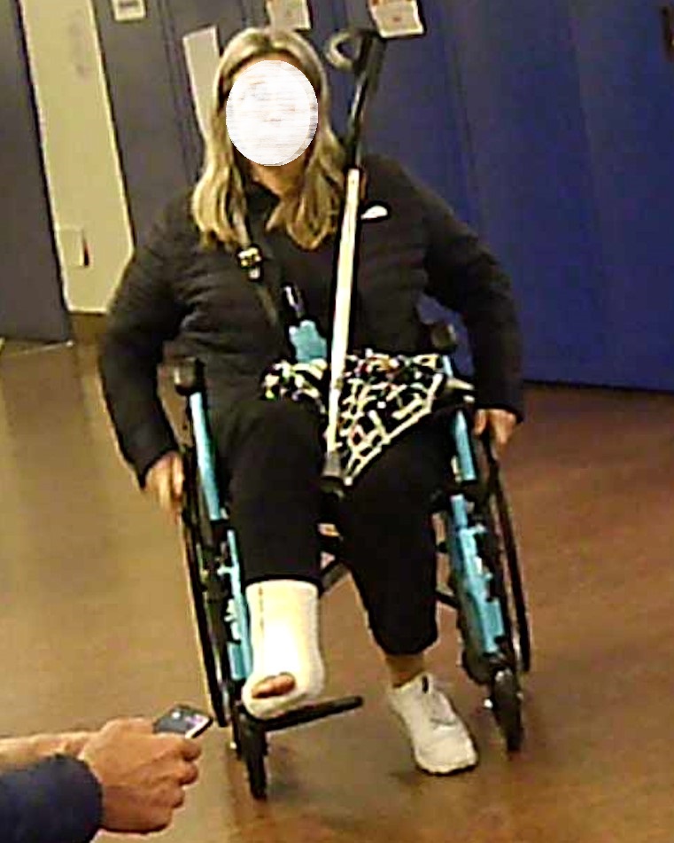 This graceful lady broke her right ankle.  She wears a white SLC,  with her fingers exposed.  She moves around in her wheelchair.  Beautiful close-ups on his cast.  Vid 6:41