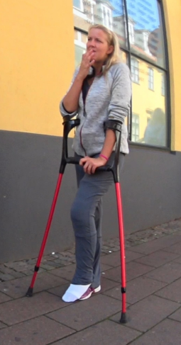 Alva Medical LLC #73 - Alva's crutching out of store with a left leg in a cast that covers the entire leg. So with the leg in front of her crutch Alva down for her, unknown streets in Denmark where there are plenty of small shops, but many of them...