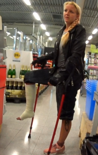 Alva Term SLC #1-5 - With a white SLC, Alva takes her red crutches and jumps into a discount store and looks around. Alva stops to look at the range of movies and CDs and puts up her casted leg to rest it on one crutch. She then jumps between...