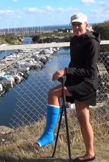 Rose 80 SLC - Rose jumps out from the car and crutch first out to a seawalk but soon turn right and crutch along a parking there she stops and looks out over the nice marina which is hidden between the rocks. + 6 more clips