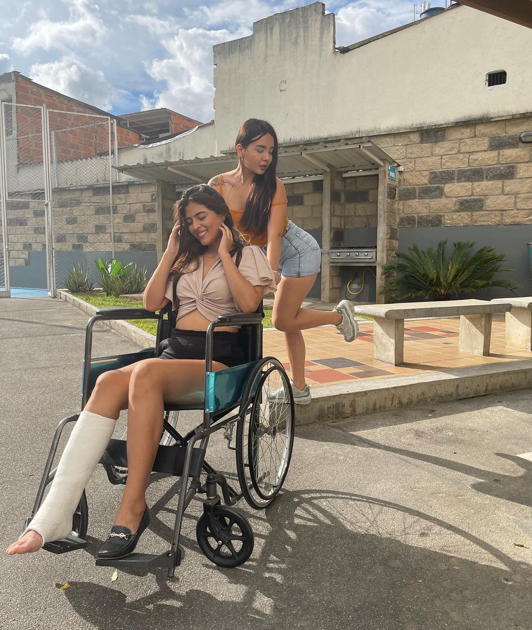 Vanessa with plaster legcast in wheelchair